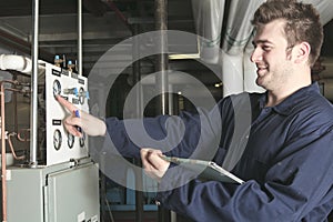 Maintenance engineer checking technical data of