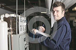 Maintenance engineer checking technical data of