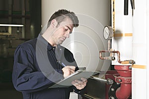 Maintenance engineer checking technical data of