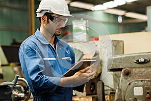 Maintenance engineer industrial plant with a tablet in hand