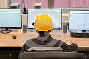 Maintenance engineer inspect relay protection system from control computer center