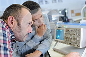 Maintenance engineer programing in industry