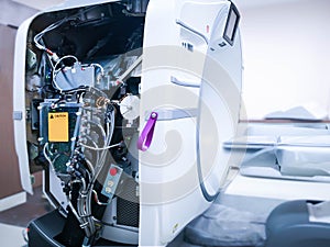 Repairing and checking CT scanner machine .