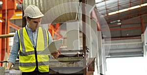 Maintenance engineers men and women inspect relay protection system with checklist document . They work a heavy industry