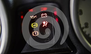 Warning lights in the dashboard of a car #2