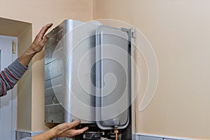 Maintenance service engineer working with home gas heating boiler