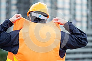 Maintenance worker man weraing reflective vest at site