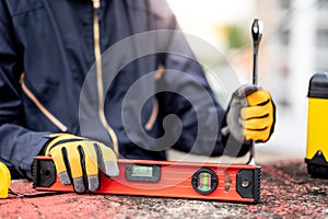 Maintenance worker preparing work tool at site