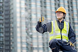 Maintenance worker showing thumb up on ladder