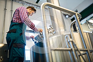 Maintenance worker working at brewery