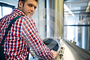 Maintenance worker working at brewery
