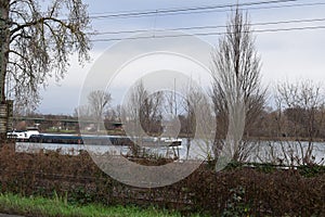 Mainz, Germany - 01 09 2023: Cargo ship at SÃ¼dbrÃ¼cke Mainz