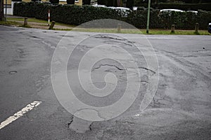 Mainz, Germany - 01 09 2023: Small city street with many potholes