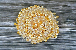 Maize or corn seeds and grains, pile of maize kernels that is used for popcorn and many other meals, The yellow maizes derive