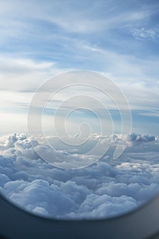 Majastic cloudscape view through porthole