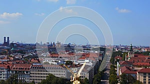 Majestic aerial view flight drone Gold Angel of Peace column City town Munich