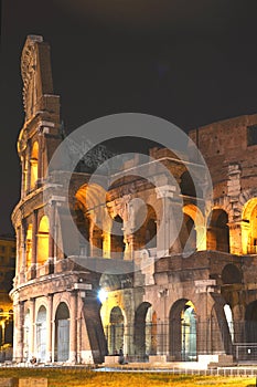 Majestic ancient Colosseum by night in Rome, Italy