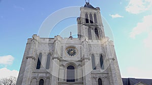 Majestic Basilica of Saint Denis church against sunny bright blue sky background