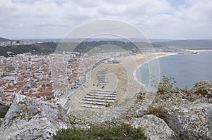 Panorama with Praia do Norte on Pedemeira bay sand beach of Nazare Resort in Portugal photo