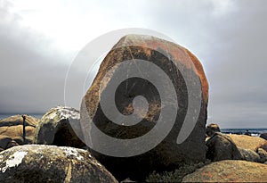 Majestic black granite boulders on the shore