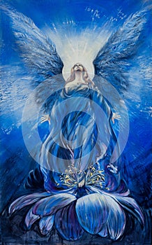 Majestic blue angel of love looks up in the radiance to the divine sky