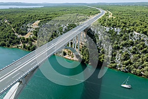 Majestic bridge spanning Adriatic Sea offers breathtaking views of surrounding nature.