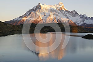 The Majestic Cuernos del Paine reflection during sunrise in Lake Pehoe in Torres del Paine National Park, Patagon photo