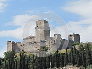 A majestic fortress overlooks the township of Assisi in Italy