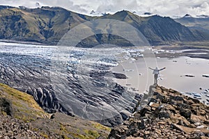 Majestic glacier Vatnajokull in iceland, tourist girl reached the top