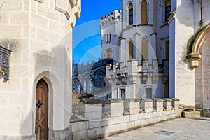 Majestic gothic castle exterior with blue sky and stone architecture