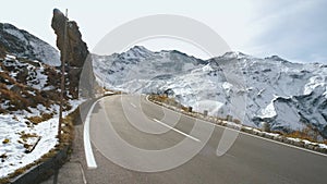 Majestic Grossglockner Mountain Road in Austria, snow covered sharp peaks of the alpine mountains. POV shot of most