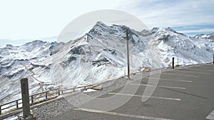 Majestic Grossglockner Mountain Road in Austria, snow covered sharp peaks of the alpine mountains. POV shot of most