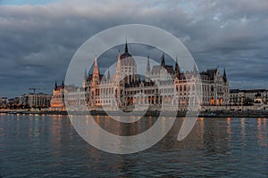 Majestic Hungarian Parliament building stands against a stunning backdrop of dark clouds