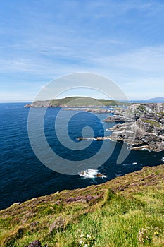 Majestic Irish Cliffs: Azure Skies, Gentle Waves, and Coastal Splendor