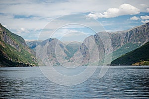 majestic landscape with beautiful mountains and calm water of Aurlandsfjord Flam