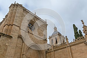 Majestic lateralview at the iconic spanish Romanesque architecture building at the Cuidad Rodrigo cathedral, tower and dome, photo