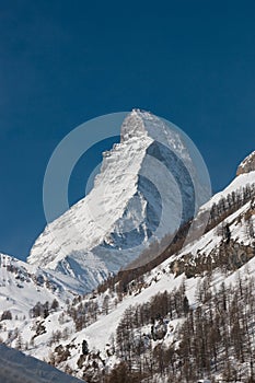 Majestic Matterhorn mountain in front of a blue sky