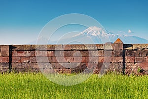 Majestic Mount Ararat or Sis and Masis in Armenian with an ancient wall in the foreground, demonstrates the border between the