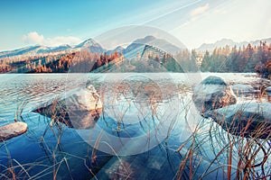 Majestic mountain lake in National Park High Tatra. Strbske ples