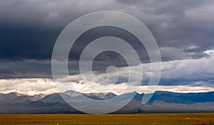 Majestic mountain landscape, cloudy sky before a thunderstorm.