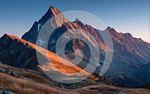 Majestic Mountain Peak at Sunset with Golden Slopes