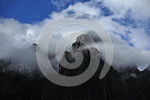 Majestic mountain peaks covered under clouds