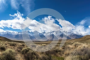 majestic mountain range with rolling clouds and blue skies