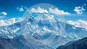 A majestic mountain range, with snow-capped peaks towering against a backdrop of clear blue skies