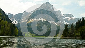 Majestic mountain range and upper lake in Switzerland