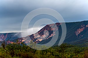 Majestic Mountain and Sand Dunes under Stormy Skies