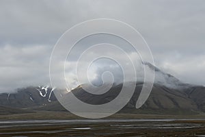 Majestic mountains landscape under sky with clouds in Norway