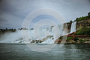 Majestic Niagara Falls waterfall with a cloudy  sky in the background in the United States