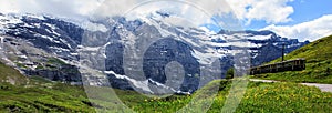 Majestic panoramic view of scenery along a swiss railways train, connecting Kleine Scheidegg to Wengernalp stations, Switzerland