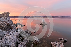 Majestic pink twilight  in Mono Lake, California with rough rock formations